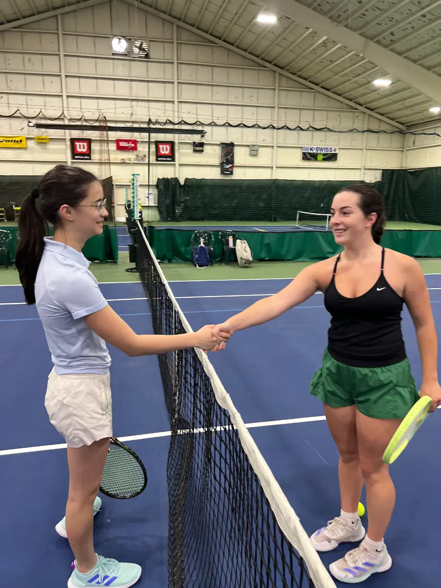 girls shaking hand before tennis match